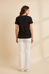 T-shirt con pietre bianche e nere