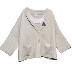 Cardigan con spilla
