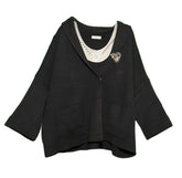 Cardigan con spilla