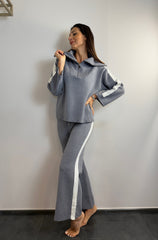 Tuta con zip e collo alto