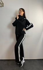 Tuta con zip e collo alto