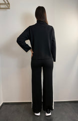 Tuta con zip e collo alto