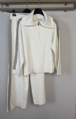 Tuta con zip e collo alto