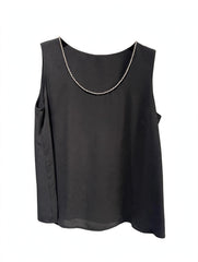 TOP SMANICATO CON DETTAGLIO LUMINOSO