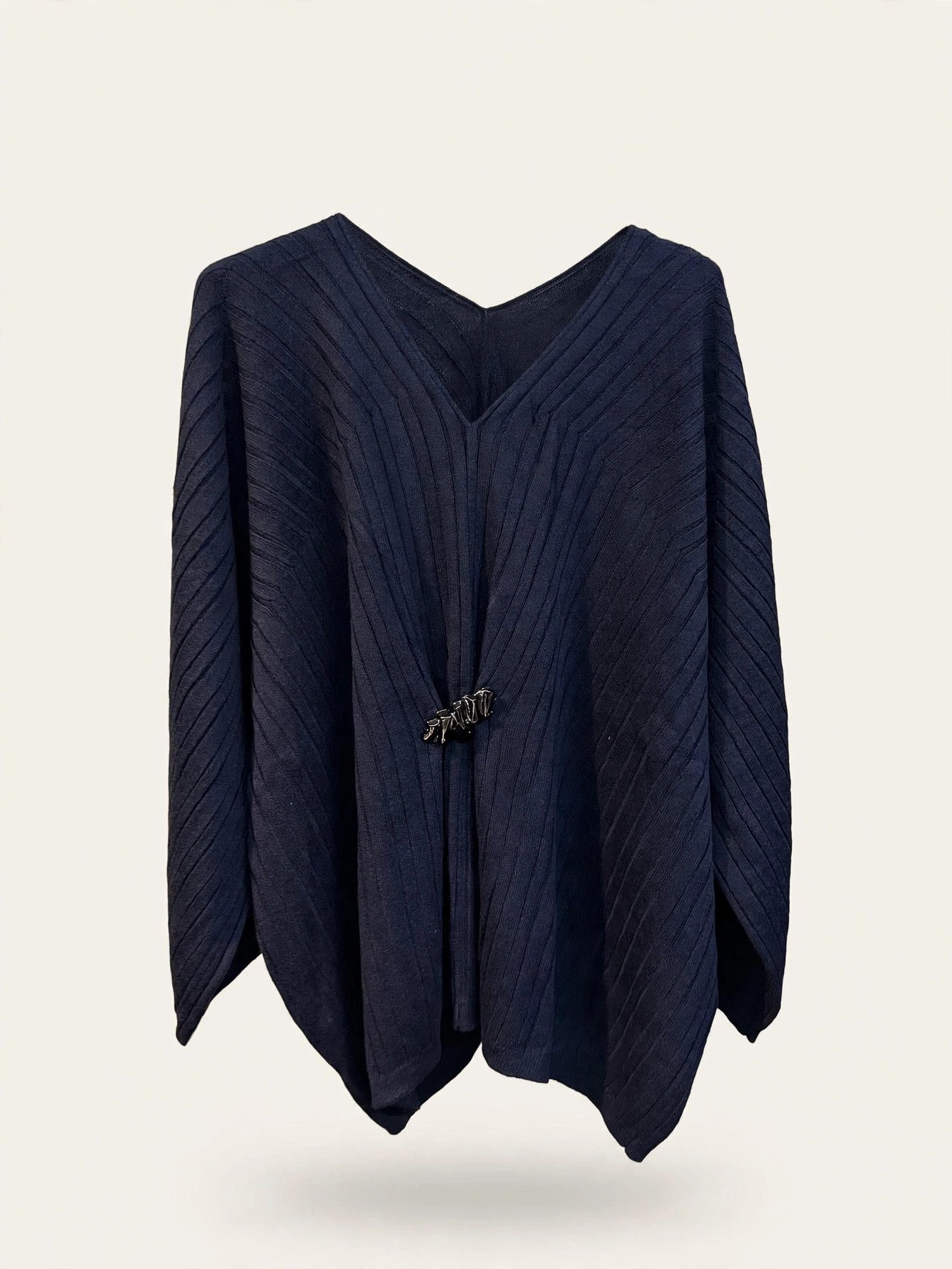 MAGLIA PONCHO CON DETTAGLIO CENTRALE ORO